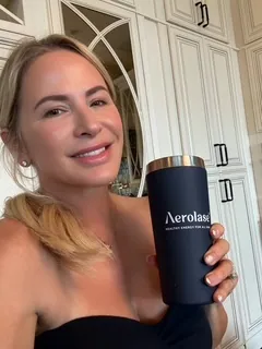 Loren holding a tumbler from the new laser platform arriving at the studio