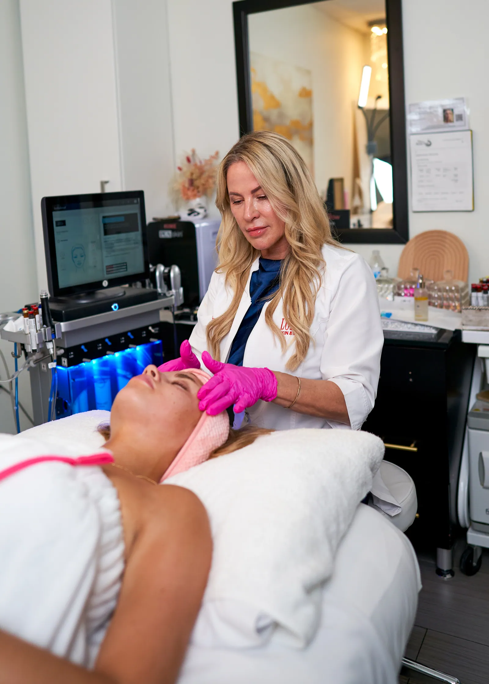 Loren working on a client during a HydraFacial treatment